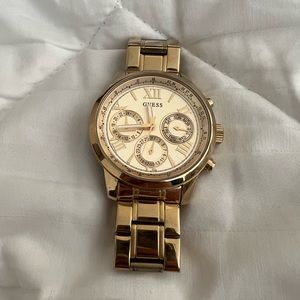 Guess (gold color) watch. Battery needs to be replaced.